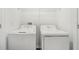 Laundry room with a stacked washer and dryer unit at 4280 Banjo Lake Rd, Land O Lakes, FL 34639