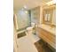 Bright bathroom with walk-in shower, modern vanity, and neutral decor at 5855 Midnight Pass Rd # 108, Sarasota, FL 34242