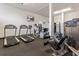 Well-equipped gym with treadmills, elliptical, weights, and other exercise equipment at 5855 Midnight Pass Rd # 108, Sarasota, FL 34242