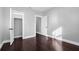 Empty bedroom with dark hardwood floors and white trim at 603 W Emma St, Tampa, FL 33603