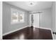 Bedroom with dark wood floors, gray walls, and a sliding barn door at 603 W Emma St, Tampa, FL 33603