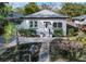 Charming white bungalow with landscaped yard and paved driveway at 603 W Emma St, Tampa, FL 33603