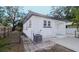 Exterior view showcasing the side of the house with AC unit and fenced yard at 603 W Emma St, Tampa, FL 33603