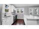 Bright kitchen with white cabinets, stainless steel appliances, and ample counter space at 603 W Emma St, Tampa, FL 33603