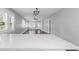 View from the kitchen into the adjacent living area with dark wood floors at 603 W Emma St, Tampa, FL 33603