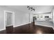 Open-concept living area with the kitchen visible in the background at 603 W Emma St, Tampa, FL 33603