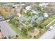 Aerial view of a house with solar panels, surrounded by palm trees and other houses at 320 47Th N Ave, St Petersburg, FL 33703