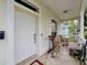 Inviting front porch with rocking chair and potted plants at 320 47Th N Ave, St Petersburg, FL 33703