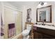 Well-appointed bathroom with a shower, vanity, and updated fixtures at 4920 Sedeno Dr, Zephyrhills, FL 33541