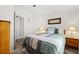 Cozy guest bedroom with a comfortable bed and bedside tables at 4920 Sedeno Dr, Zephyrhills, FL 33541