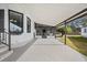 Covered carport with steps leading to the screened-in porch and home entrance at 4920 Sedeno Dr, Zephyrhills, FL 33541