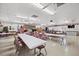 Spacious clubhouse interior with tables, chairs, and holiday decor at 4920 Sedeno Dr, Zephyrhills, FL 33541