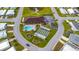 An aerial view of community center with a pool and shuffleboard court at 4920 Sedeno Dr, Zephyrhills, FL 33541