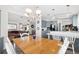 Dining room with table and chairs, open to the kitchen and living room at 4920 Sedeno Dr, Zephyrhills, FL 33541