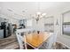 Dining area with table, chairs, and a view into the kitchen at 4920 Sedeno Dr, Zephyrhills, FL 33541