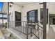 Inviting front porch with railing, stairs, and decorative elements at 4920 Sedeno Dr, Zephyrhills, FL 33541