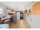 Laundry room with washer, dryer, storage shelves, and a bicycle at 4920 Sedeno Dr, Zephyrhills, FL 33541