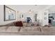 Living room with sectional sofa, recliner, and view into the kitchen at 4920 Sedeno Dr, Zephyrhills, FL 33541