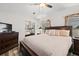 Comfortable main bedroom suite featuring a ceiling fan and neutral decor at 4920 Sedeno Dr, Zephyrhills, FL 33541