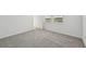 Carpeted bedroom features several windows to the outdoors at 14061 Crutchfield Ct, Parrish, FL 34219
