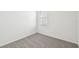 Small bedroom with neutral carpet and a single window at 14061 Crutchfield Ct, Parrish, FL 34219