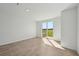 Bright living room with sliding glass doors and tile floors at 14061 Crutchfield Ct, Parrish, FL 34219