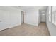 Bright living room with tiled flooring, offering a clean and modern aesthetic at 14061 Crutchfield Ct, Parrish, FL 34219
