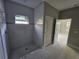 Modern bathroom with walk-in shower and marble floors at 2840 S Biscayne Dr, North Port, FL 34287