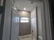 Clean bathroom with tub and window at 2840 S Biscayne Dr, North Port, FL 34287