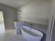 Modern bathroom with a large soaking tub and double vanity at 2840 S Biscayne Dr, North Port, FL 34287