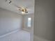 Spacious bedroom with large window and ceiling fan at 2840 S Biscayne Dr, North Port, FL 34287