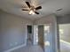 Spacious bedroom with ceiling fan and closet at 2840 S Biscayne Dr, North Port, FL 34287