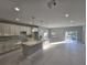 Modern kitchen with white cabinets, quartz countertops, and island at 2840 S Biscayne Dr, North Port, FL 34287