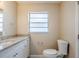 Bathroom with granite countertop and updated vanity at 4110 E Comanche Ave, Tampa, FL 33610