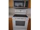 Kitchen with Whirlpool stove, microwave, and oven at 601 Shreve St # 51A, Punta Gorda, FL 33950