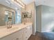 Double vanity bathroom with a large mirror and tile flooring at 6629 Pineview Ter # 5-201, Bradenton, FL 34203