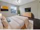 Main bedroom with a dresser and plenty of space at 6629 Pineview Ter # 5-201, Bradenton, FL 34203