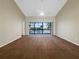 Bright bedroom with large windows and sliding glass doors at 6629 Pineview Ter # 5-201, Bradenton, FL 34203