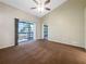 Bedroom with sliding glass doors leading to a balcony at 6629 Pineview Ter # 5-201, Bradenton, FL 34203