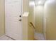 Simple entryway with white door and staircase to upper level at 6629 Pineview Ter # 5-201, Bradenton, FL 34203