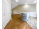 Kitchen with an island and wood-look flooring at 6629 Pineview Ter # 5-201, Bradenton, FL 34203