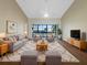 Spacious living room with vaulted ceilings and comfy furniture at 6629 Pineview Ter # 5-201, Bradenton, FL 34203
