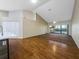 Open living area with hardwood floors and access to balcony at 6629 Pineview Ter # 5-201, Bradenton, FL 34203