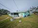 Large backyard with fire pit and storage shed at 1041 Porpoise Rd, Venice, FL 34293