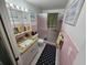 Bathroom with pink tile and shower at 1041 Porpoise Rd, Venice, FL 34293