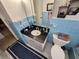 Bathroom with dark vanity and blue tile at 1041 Porpoise Rd, Venice, FL 34293