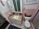 Pink bathroom with granite vanity at 1041 Porpoise Rd, Venice, FL 34293