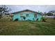 Mint green house with front yard at 1041 Porpoise Rd, Venice, FL 34293