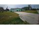 Mint green house with long driveway at 1041 Porpoise Rd, Venice, FL 34293