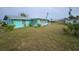 Mint green house with front yard at 1041 Porpoise Rd, Venice, FL 34293